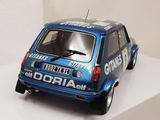 a small blue car that is sitting on a white shelf