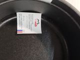 a label on a frying pan with a sticker on it