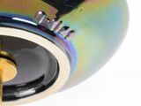 a close up view of a colorful lamp with a black base