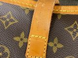 a close up of a brown louis vuitton bag