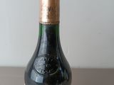 a bottle of wine that is sitting on a table