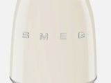 the toaster is white and has the word smeg written on it