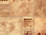 several tiles with different designs on them on a wall