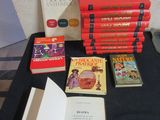 a lot of books on a table with a black table cloth