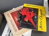 three books are stacked on top of each other on a table