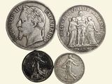 three different types of coins are shown on a white background