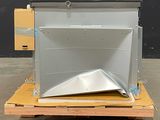 a metal object on a pallet in a warehouse