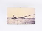 a picture of a plane that is sitting in the water