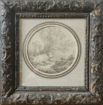 une vieille photo représentant un mouton dans un décor boisé