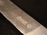 a close up of a knife on a table