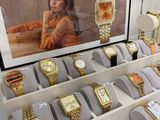 many watches on display in a glass display case