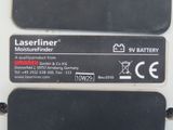 two black and white labels on a white surface with a black background