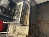 a toaster that is sitting on top of a stove
