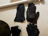 a hat, gloves, and a pair of gloves on a table