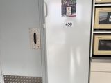 a white refrigerator in a kitchen with a microwave on top of it