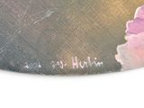 a close up of a painting of a flower on a table