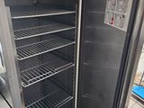 an open refrigerator that is sitting in a kitchen