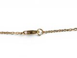 a close up of a gold chain with a clasp on a white background