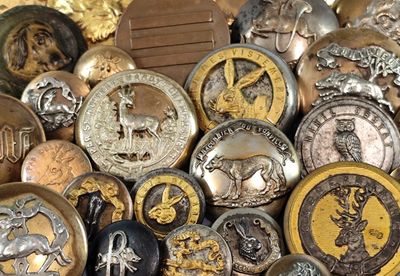 a lot of different types of buttons on a table