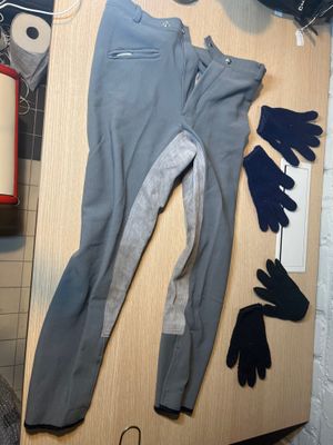 a pair of gloves, gloves, gloves, and a pair of gloves on a table