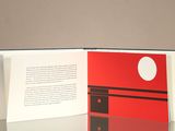 a book with a picture of a red and black building on it