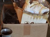 a box full of pastries and a cup of tea on a table