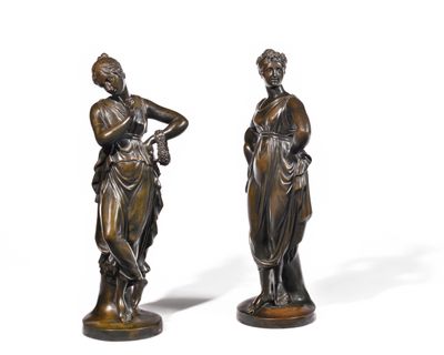pair of bronze figurines of a woman and a man