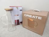 a box that has a cup inside of it next to a coffee mug