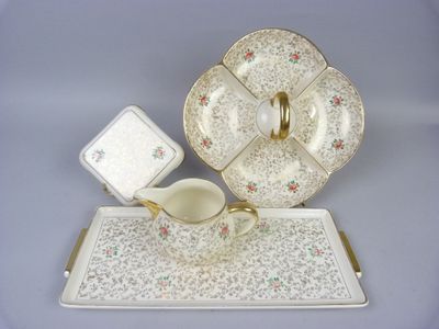 a picture of a tea set on a tray with a cup and saucer