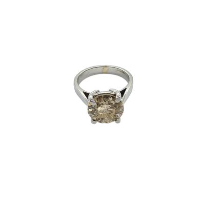 a close up of a diamond ring on a white background