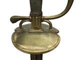 a close up of a sword on a stand on a white background