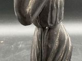 a statue of a woman holding a baby in her arms