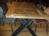 a wooden table and chairs in a room with wood flooring