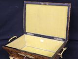 a wooden box with a mirror in it on a black background