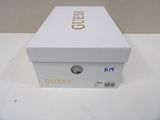 a white box with gold lettering on it on a table