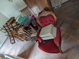 a red chair that is sitting in a living room