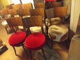 many chairs that are lined up in a room