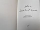 an open book with a picture of jean paul sarre on it