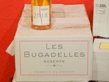bottles of wine are stacked on top of boxes on a table