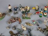 many figurines of different types and sizes on the table