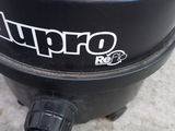 a yellow hose that is connected to a black bucket