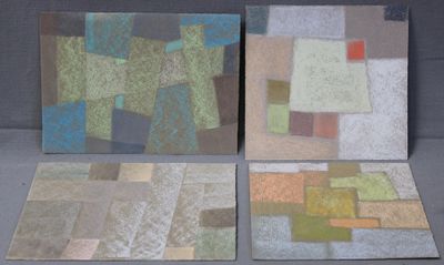 four pieces of art are displayed on a gray surface