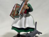 figurine of a woman with a book and a cat