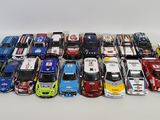 a lot of toy cars sitting on a white surface