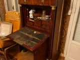 a small desk in the corner of a room