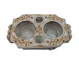 a white and gold plate with two bowls inside of it