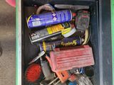 a box full of tools that are sitting on the ground