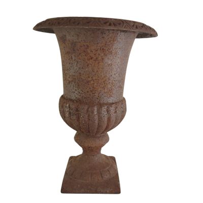 an old vase that is sitting on a stand