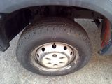 a close up of a flat tire on a truck