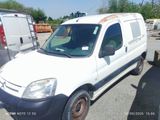 a white van that is parked in a lot